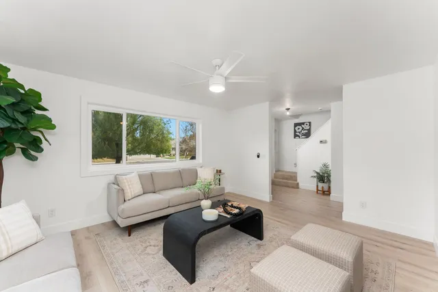 a living room with furniture and a large window