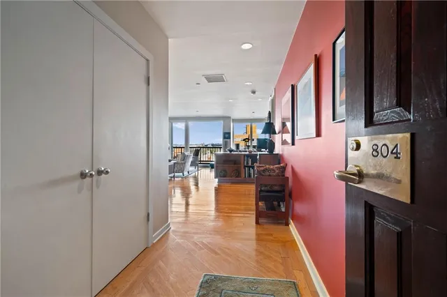 a dining hall with stainless steel appliances granite countertop a refrigerator and a stove top oven