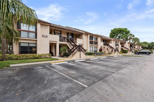 a view of a house with basketball court