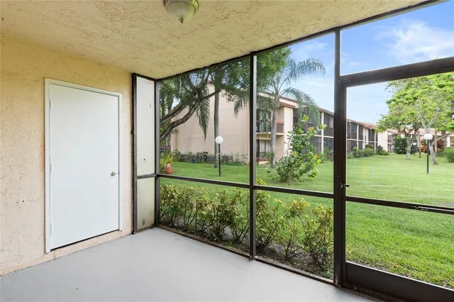 a view of a porch with a garden