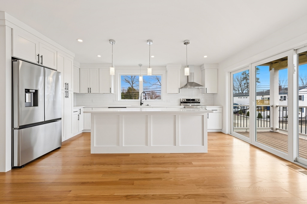 2 Old County Road, Unit 12 Salisbury, MA 01952 - Photo 2 of 29 a kitchen with stainless steel appliances granite countertop a refrigerator sink and white cabinets