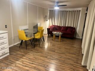 146 North Merrill Road, Unit 73 Apache Junction, AZ 85120 - Photo 10 of 19 a view of a dining room with furniture and wooden floor