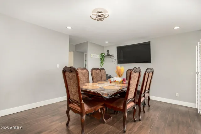 a view of a dining room with furniture and wooden floor