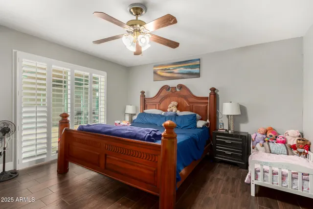 a bed room with a bed and a chandelier
