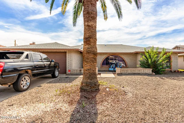 a view of a car in front of a house