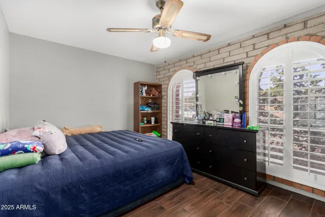 a bedroom with a bed and a mirror