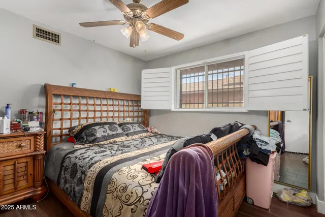 a bedroom with bed and a window