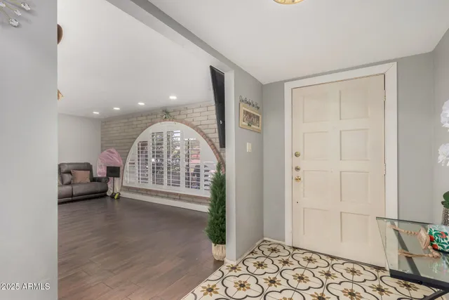a view of livingroom with furniture and a window