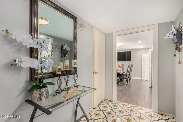 a living room with furniture and a dining table