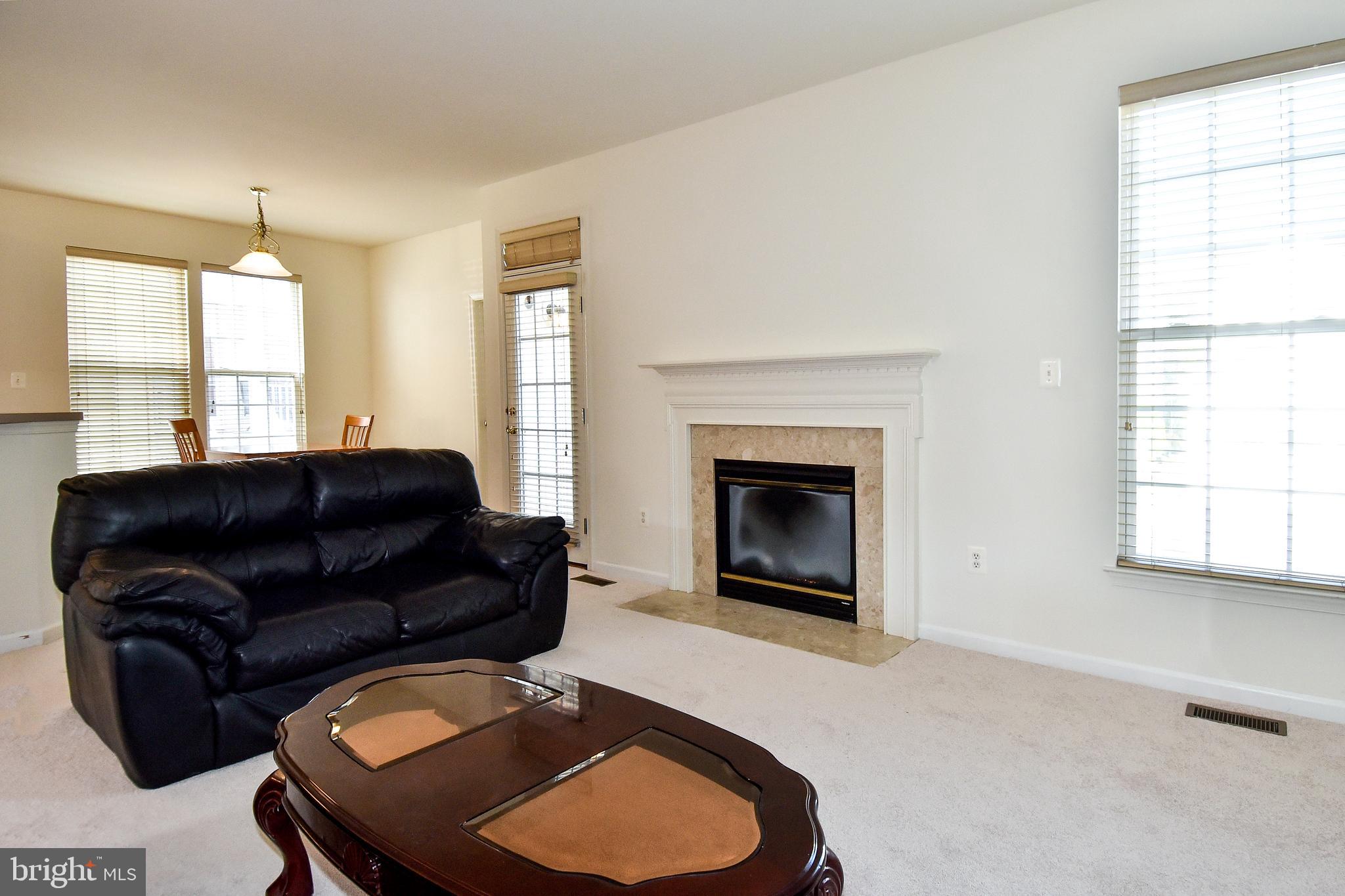 7828 Callington Way Hanover, MD 21076 - Photo 13 of 41 LIVING RM HAS ACCESS TO EXT SIDE STAIRS