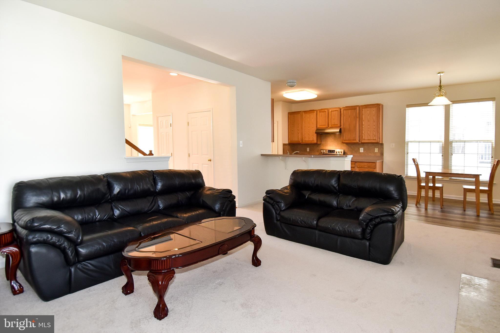 7828 Callington Way Hanover, MD 21076 - Photo 14 of 41 LIVING ROOM AND VIEW OF BREAKFAST RM AND KITCHEN