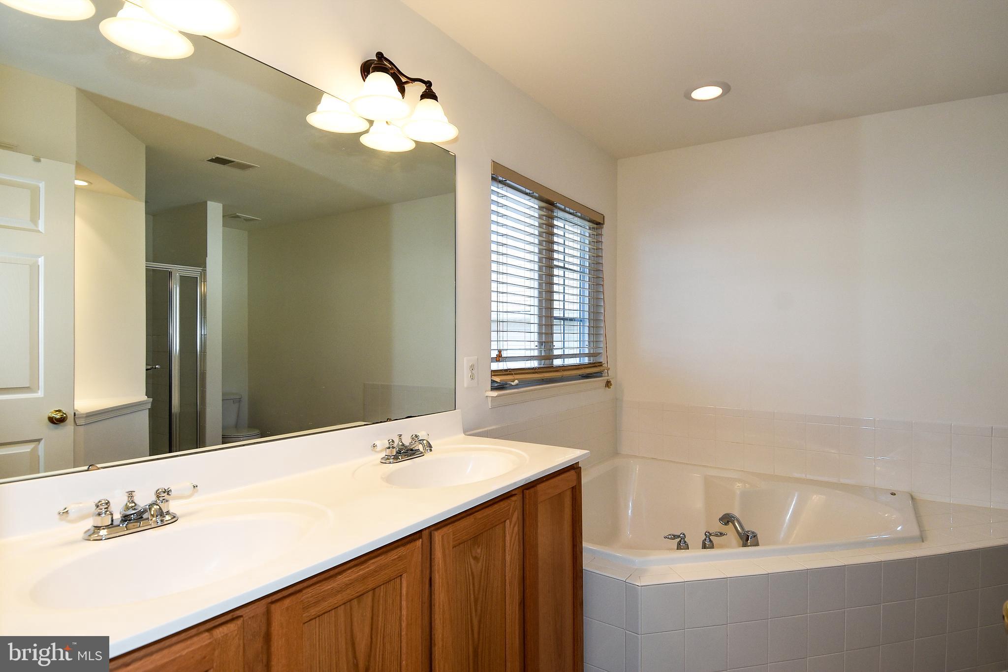 7828 Callington Way Hanover, MD 21076 - Photo 23 of 41 UPPER LEVEL PRIMARY BATHROOM HAS DUAL VANITY