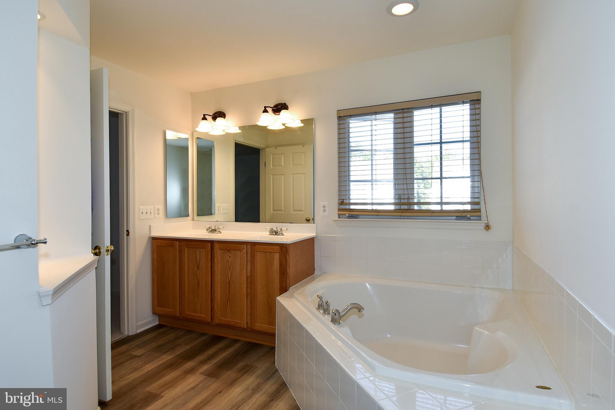 7828 Callington Way Hanover, MD 21076 - Photo 24 of 41 UPPER LEVEL PRIMARY BATHROOM HAS OVERSIZED TUB