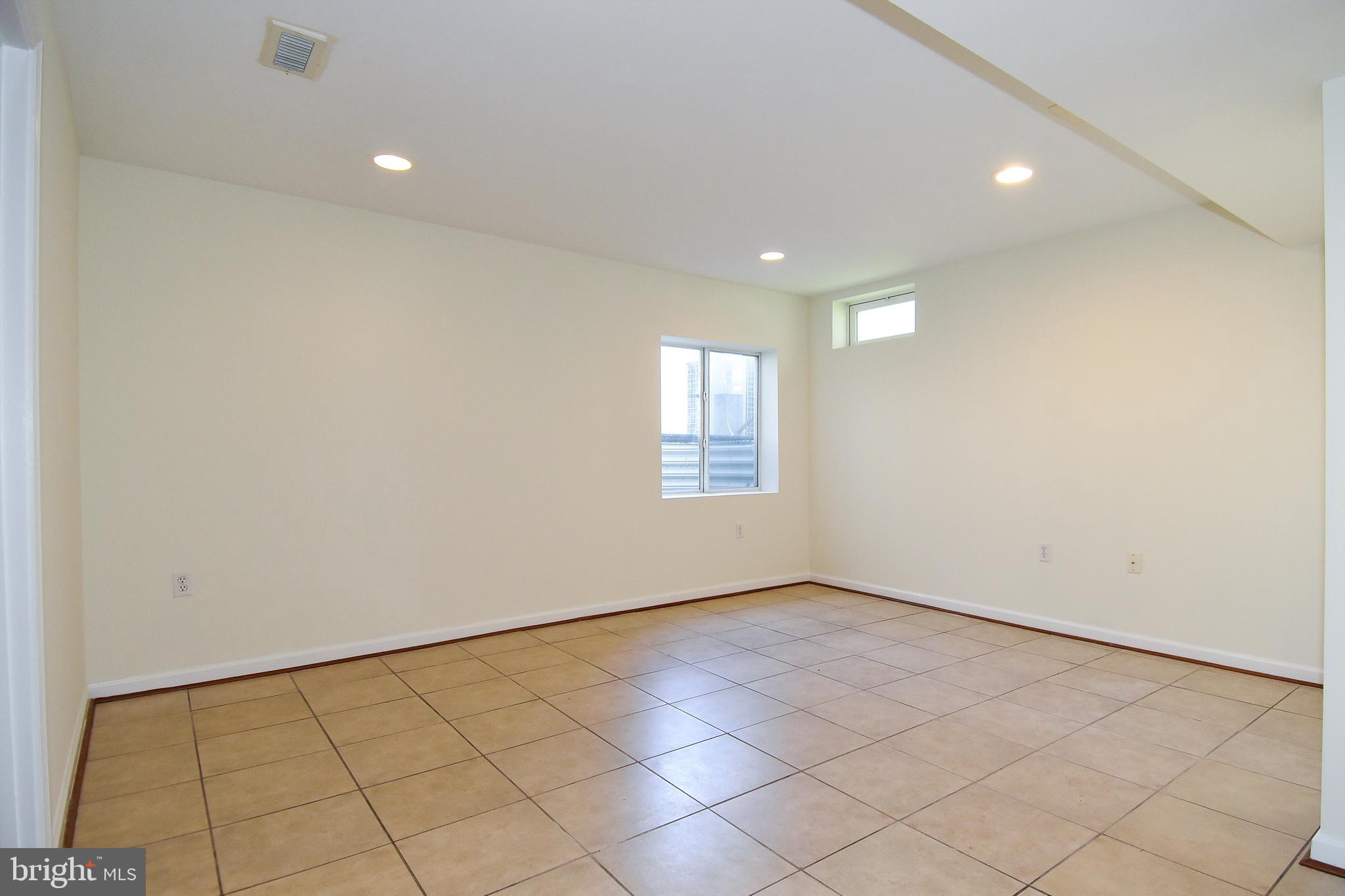 7828 Callington Way Hanover, MD 21076 - Photo 35 of 41 LOWER LEVEL RECREATIONAL ROOM HAS EGRESSED WINDOW
