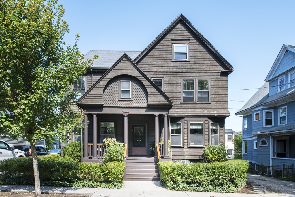 73-75 Upland Road Cambridge, MA 02140 - Photo 1 of 26 a front view of a house with garden