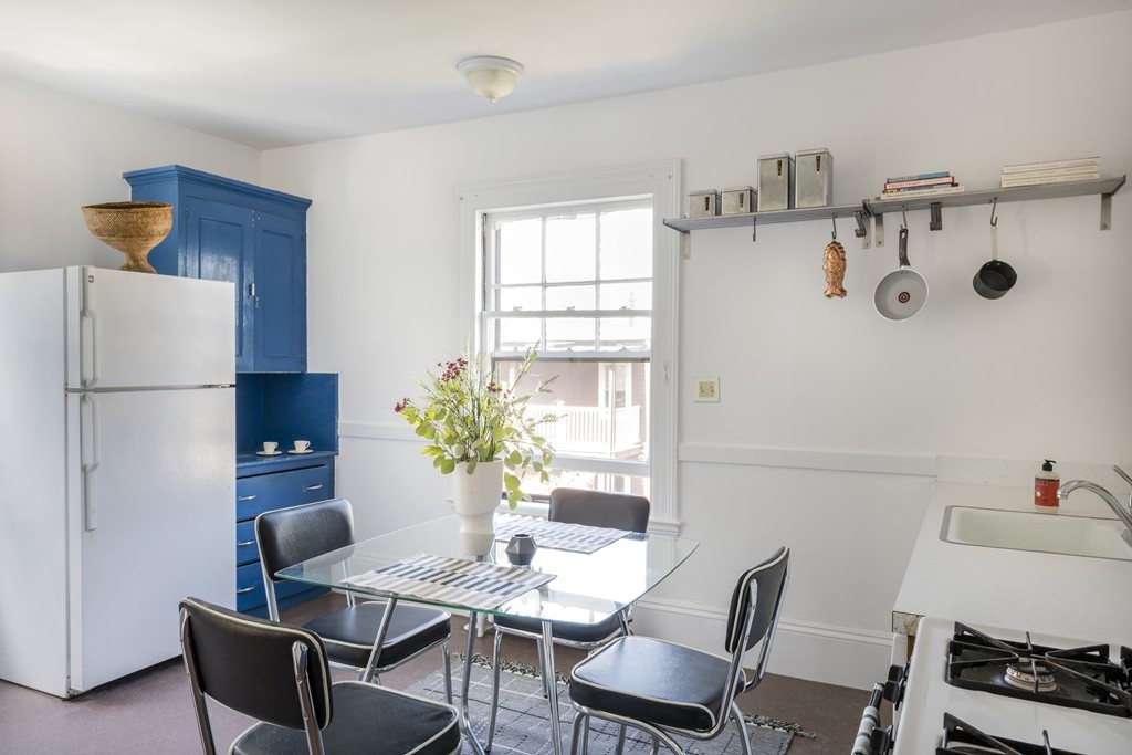 73-75 Upland Road Cambridge, MA 02140 - Photo 17 of 26 a dining room with furniture and window