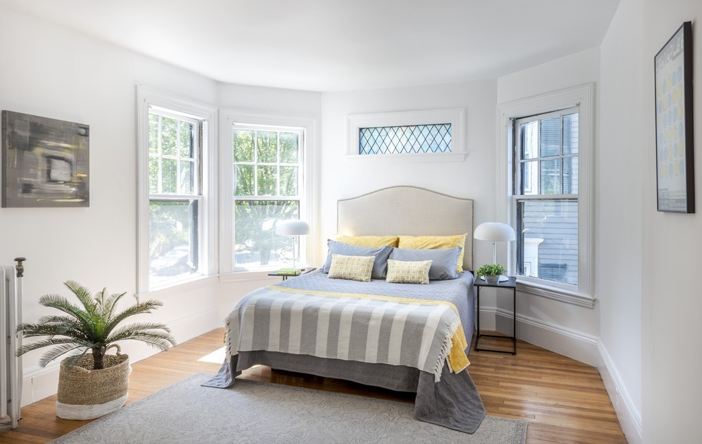 73-75 Upland Road Cambridge, MA 02140 - Photo 18 of 26 a bedroom with a bed and a couch