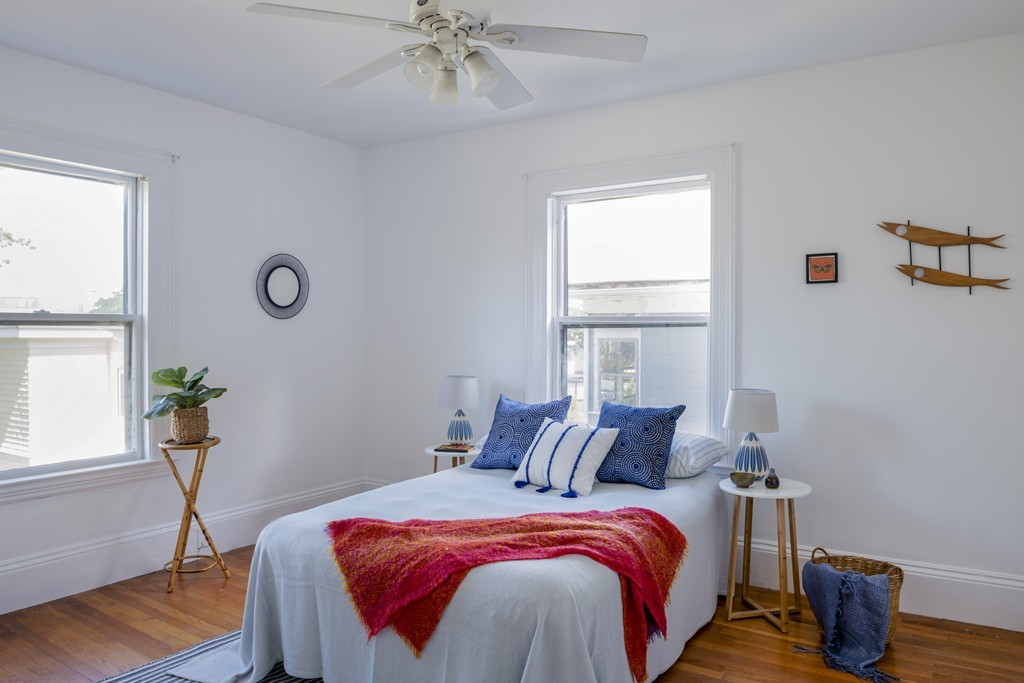 73-75 Upland Road Cambridge, MA 02140 - Photo 19 of 26 a bed sitting in a bedroom next to a window