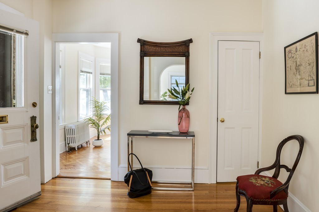 73-75 Upland Road Cambridge, MA 02140 - Photo 2 of 26 a view of living room filled with furniture and a potted plant