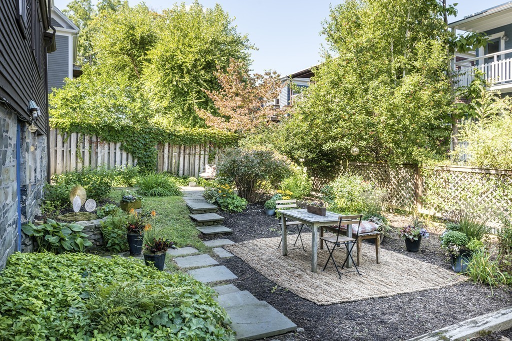 73-75 Upland Road Cambridge, MA 02140 - Photo 22 of 26 a garden view with a seating space