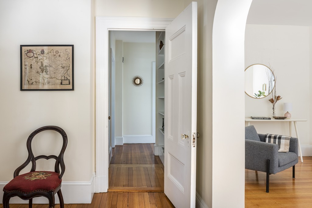 73-75 Upland Road Cambridge, MA 02140 - Photo 4 of 26 a view of a livingroom with furniture and wooden floor