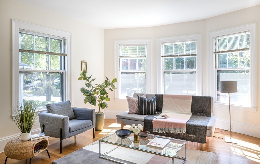 73-75 Upland Road Cambridge, MA 02140 - Photo 6 of 26 a living room with furniture and a large window