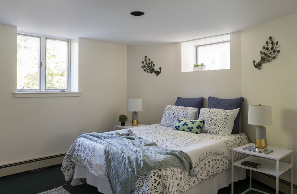 73-75 Upland Road Cambridge, MA 02140 - Photo 10 of 26 a bedroom with a bed and a window