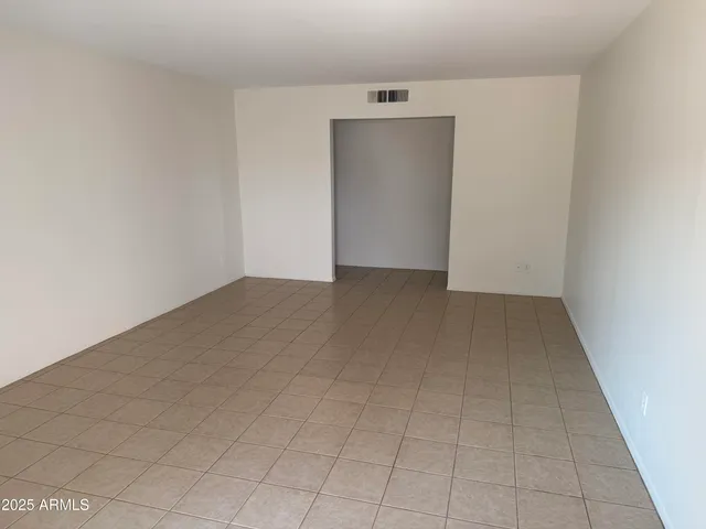 a bathroom with a toilet sink vanity and mirror
