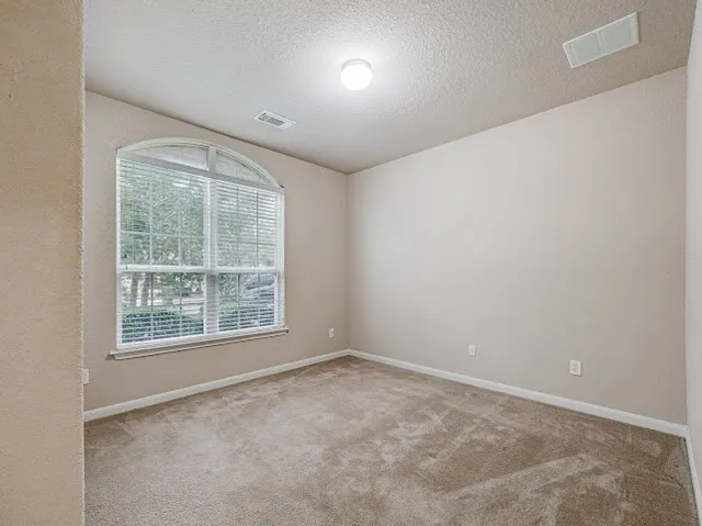 a kitchen with stainless steel appliances granite countertop wooden cabinets a stove top oven a sink and dishwasher