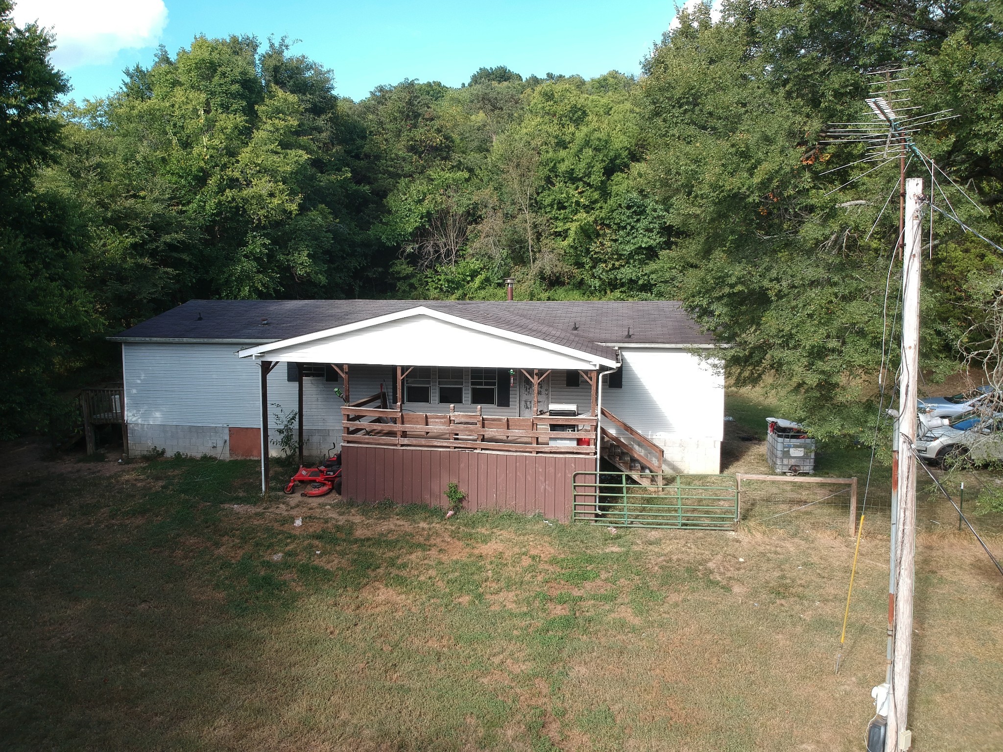 225 Opossum Hollow Road Watertown, TN 37184 - Photo 3 of 29 a backyard of a house with table and chairs