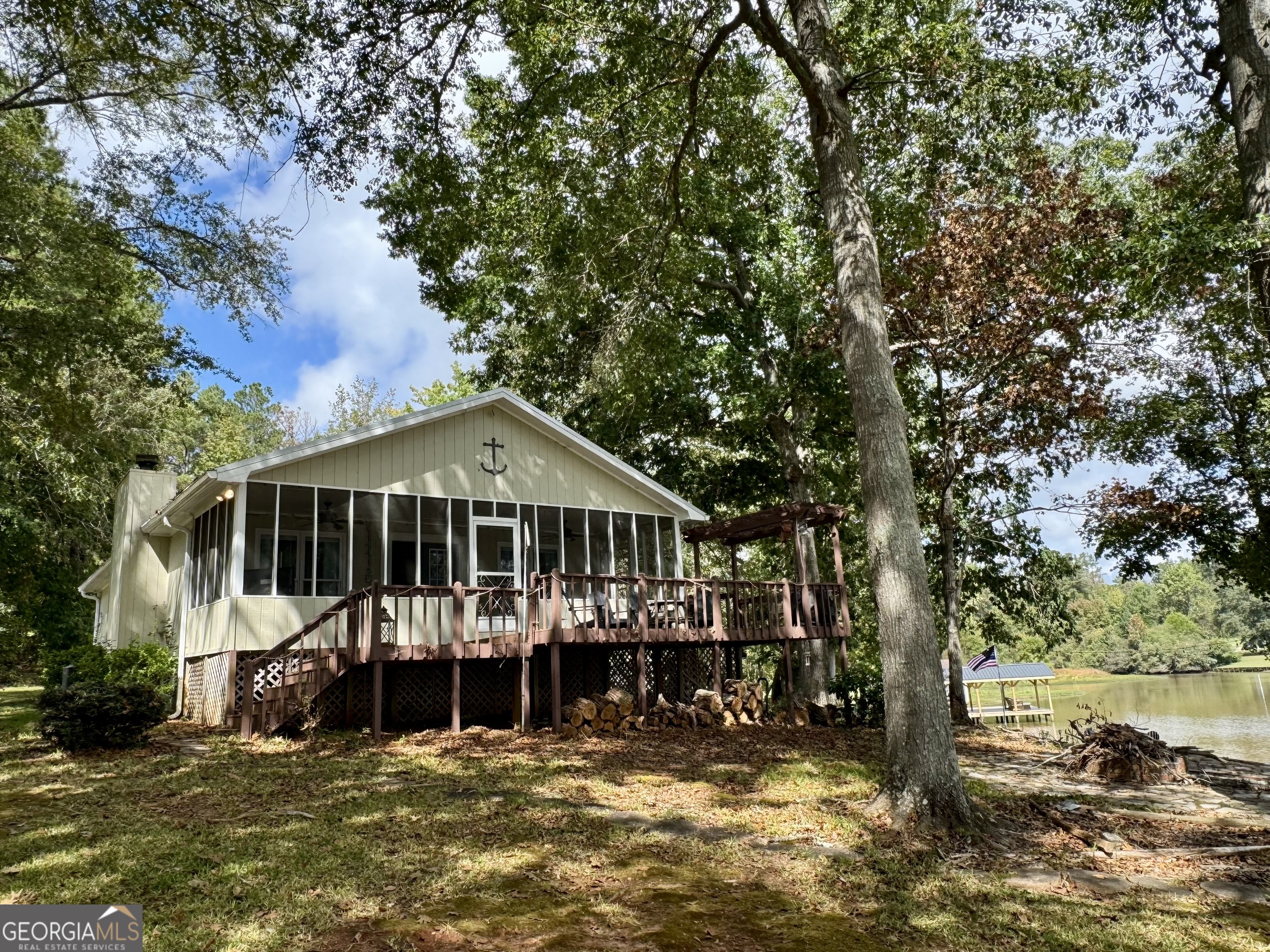 a view of a house with a yard patio and deck