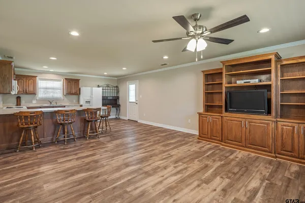 a view of a kitchen with a sink and cabinets