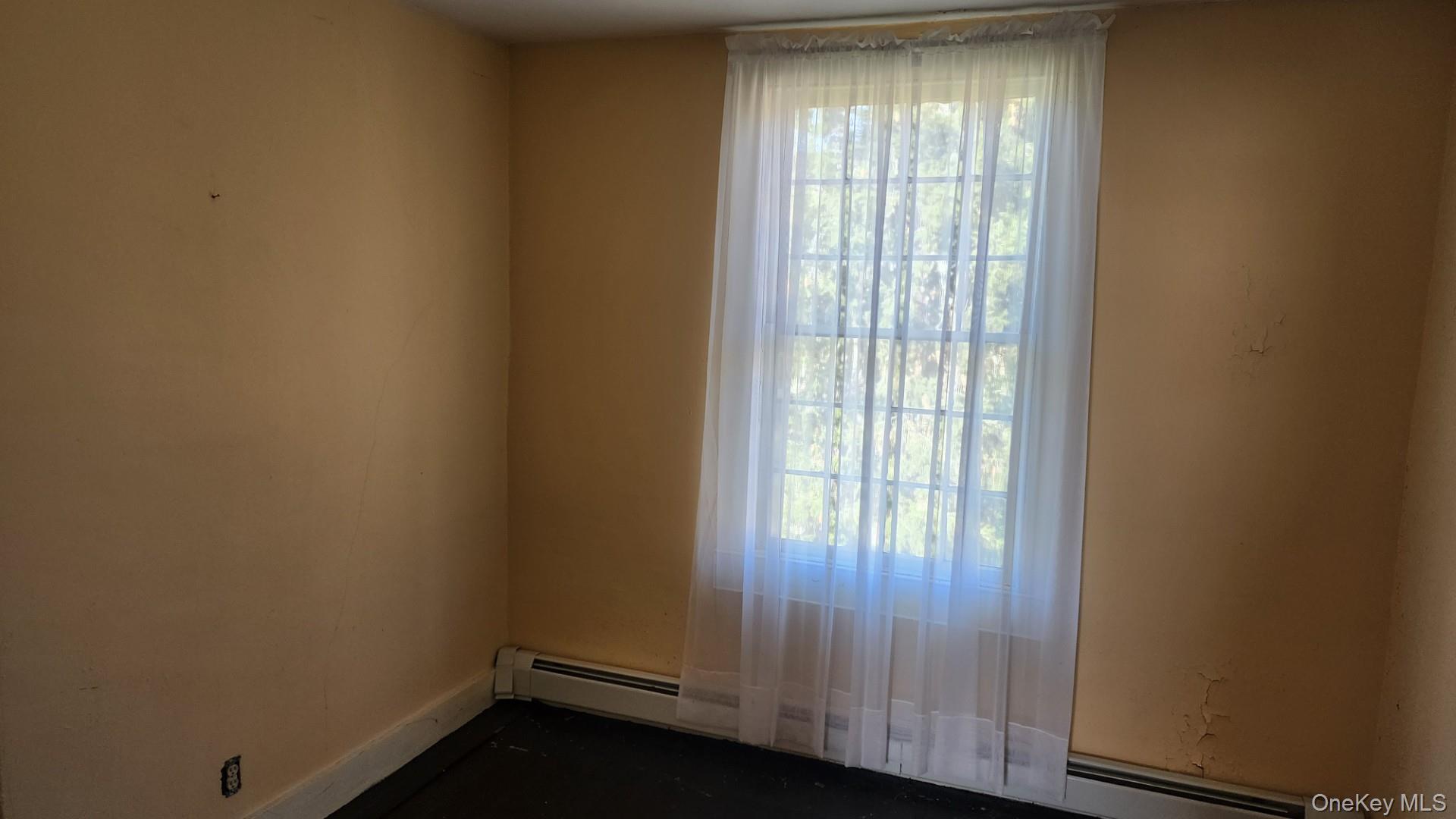 175 Waccabuc Road Goldens Bridge, NY 10526 - Photo 24 of 36 Unfurnished room featuring a baseboard heating unit and baseboards