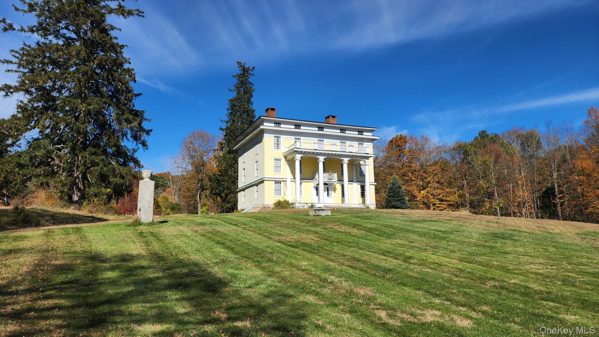 175 Waccabuc Road Goldens Bridge, NY 10526 - Photo 8 of 36 Neoclassical home featuring a front yard and a chimney