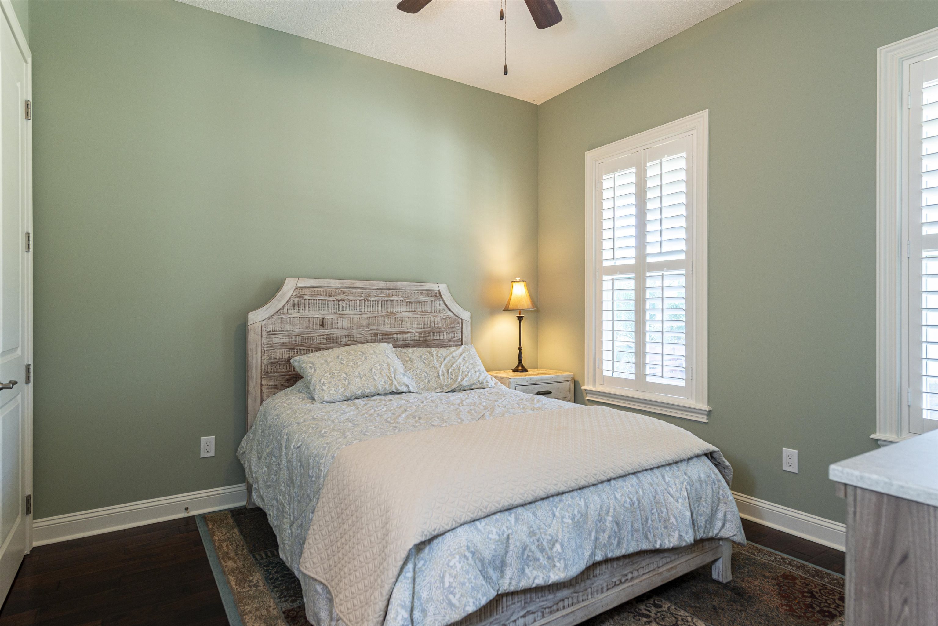 5475 Riverwood Road North St. Augustine, FL 32092 - Photo 20 of 62 Bedroom with dark wood-style flooring and ceiling fan
