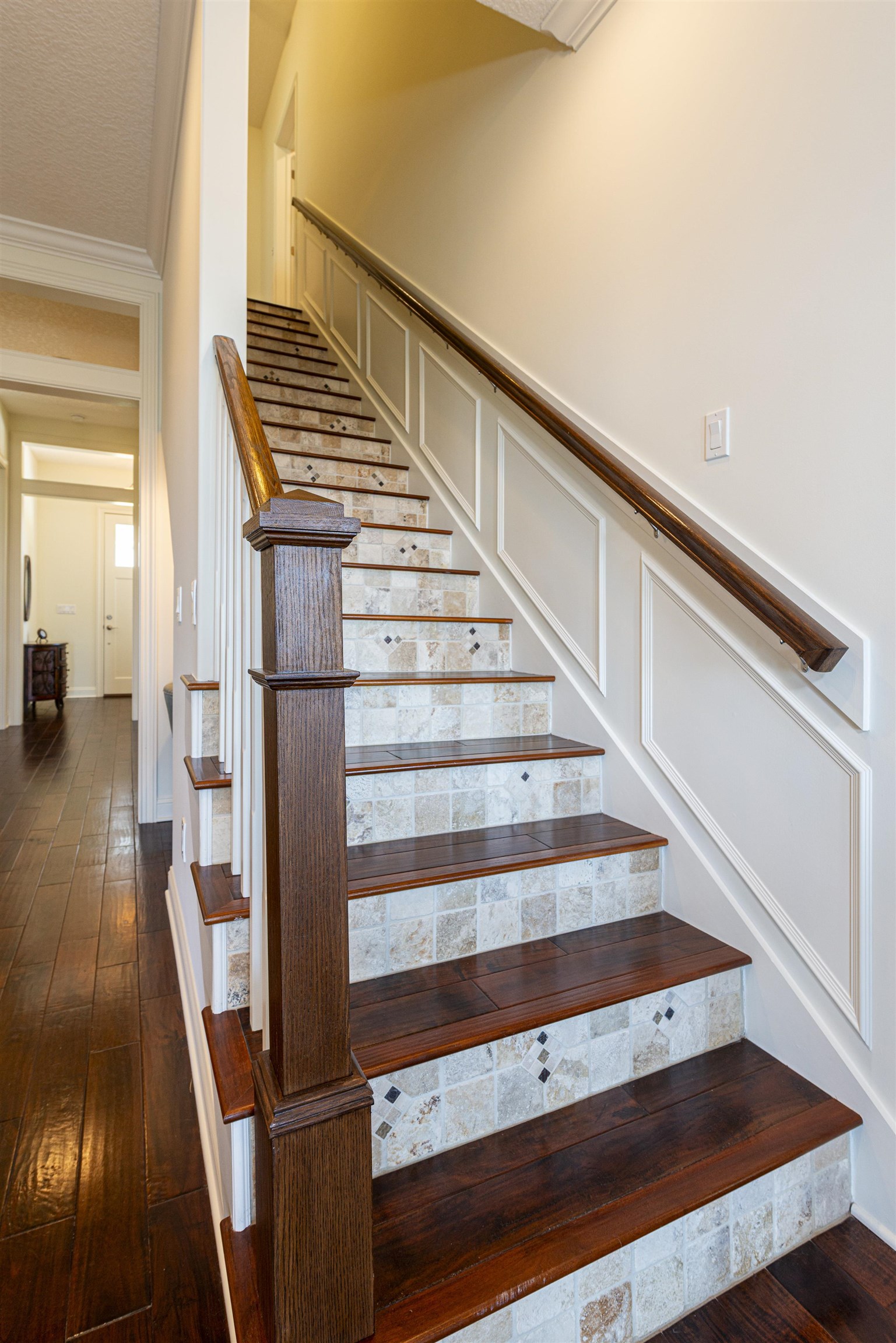 5475 Riverwood Road North St. Augustine, FL 32092 - Photo 24 of 62 Staircase featuring hardwood / wood-style floors and ornamental molding