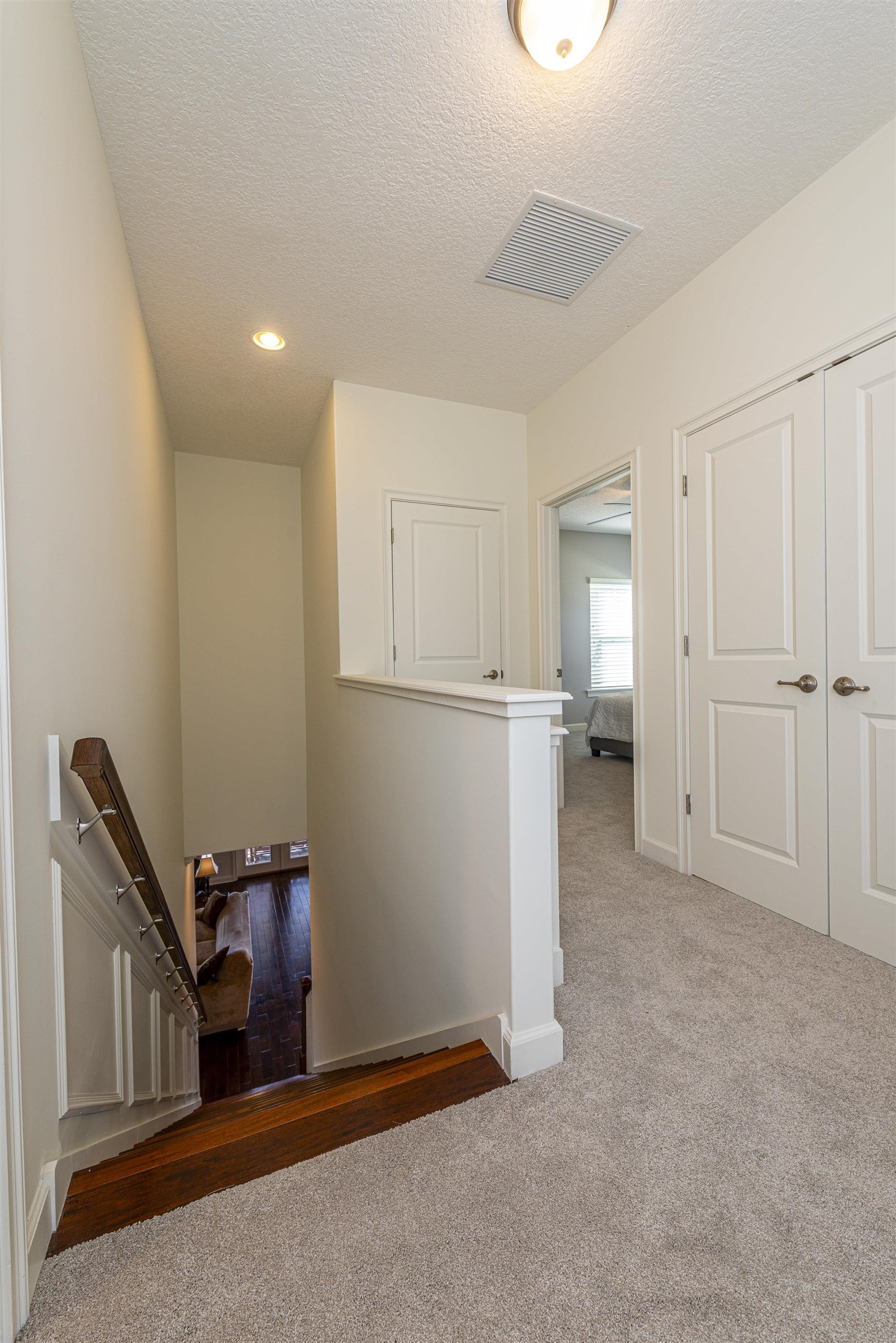 5475 Riverwood Road North St. Augustine, FL 32092 - Photo 26 of 62 Corridor with a textured ceiling and carpet flooring