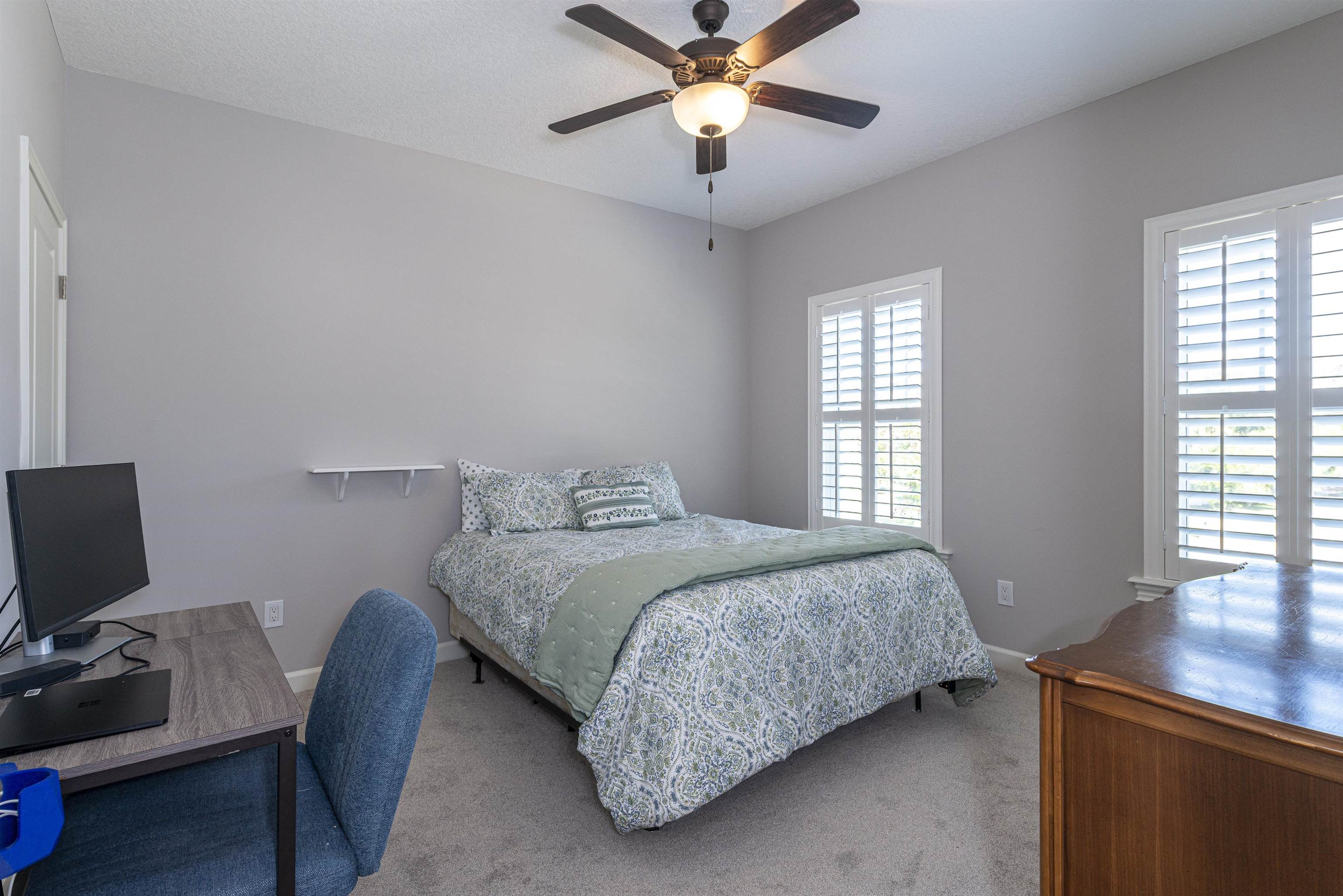 5475 Riverwood Road North St. Augustine, FL 32092 - Photo 26 of 62 Bedroom with a desk, carpet floors, and a ceiling fan