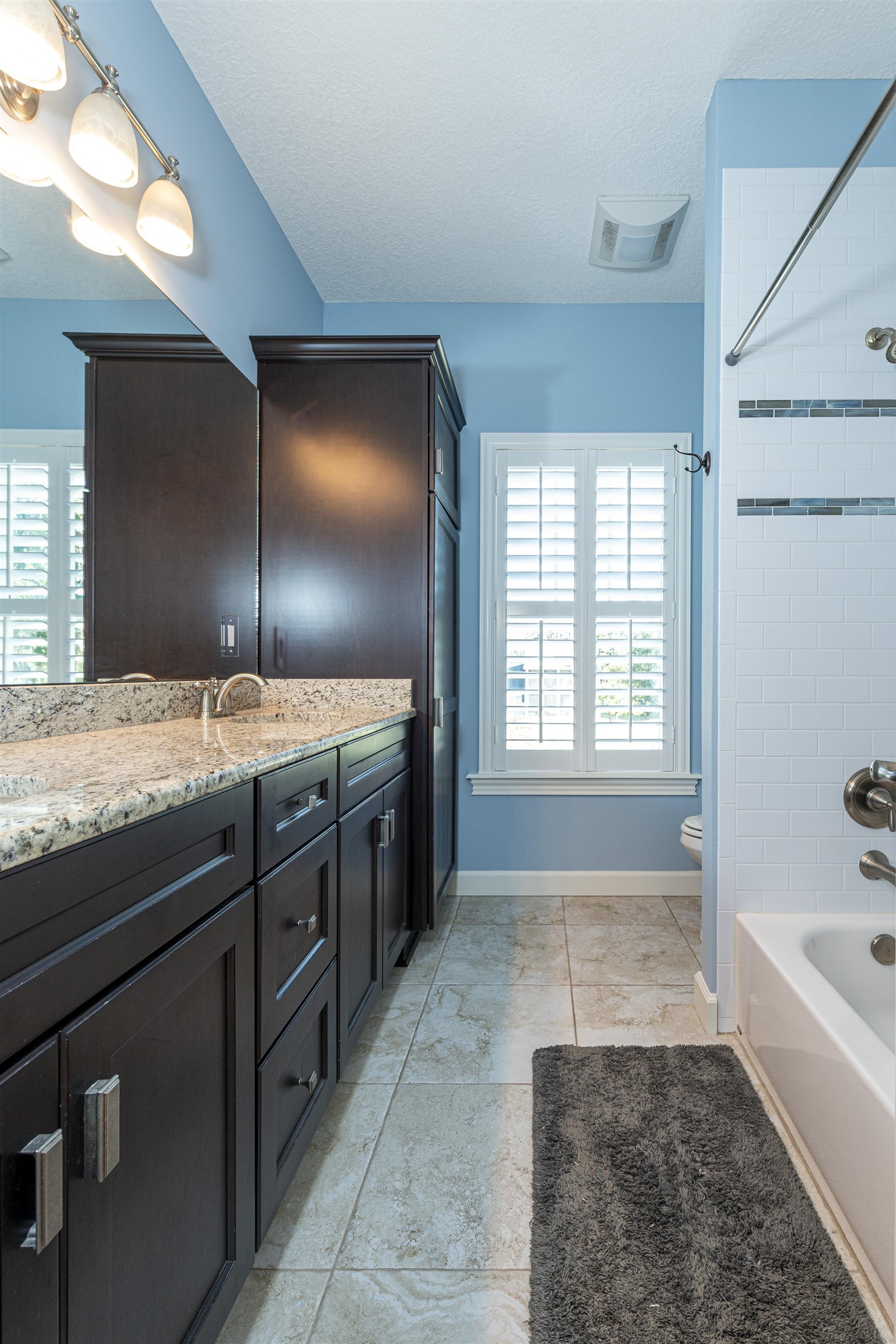 5475 Riverwood Road North St. Augustine, FL 32092 - Photo 29 of 62 Full bathroom with shower / washtub combination, plenty of natural light, vanity, and a textured ceiling