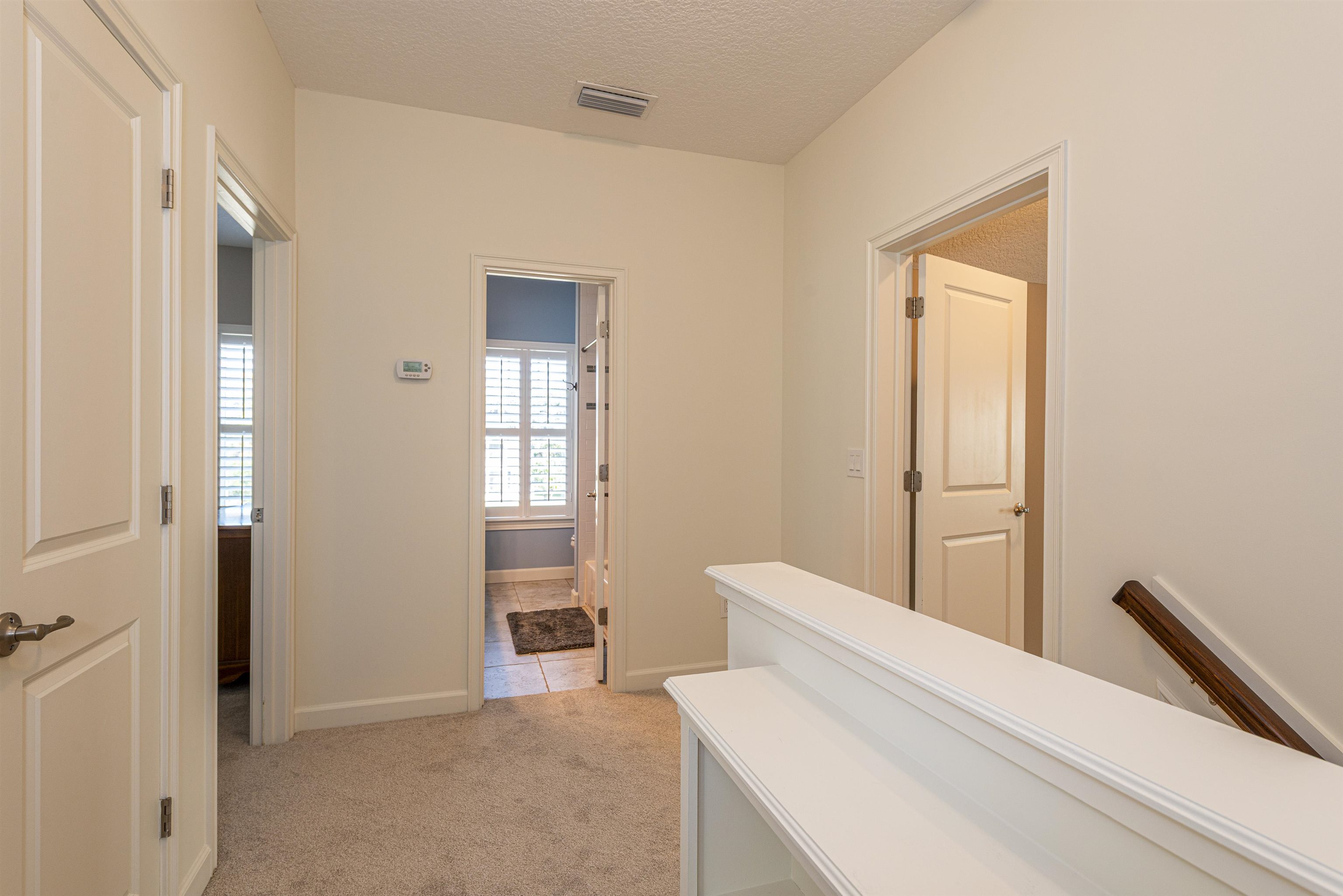 5475 Riverwood Road North St. Augustine, FL 32092 - Photo 29 of 62 Hall featuring light carpet and a textured ceiling