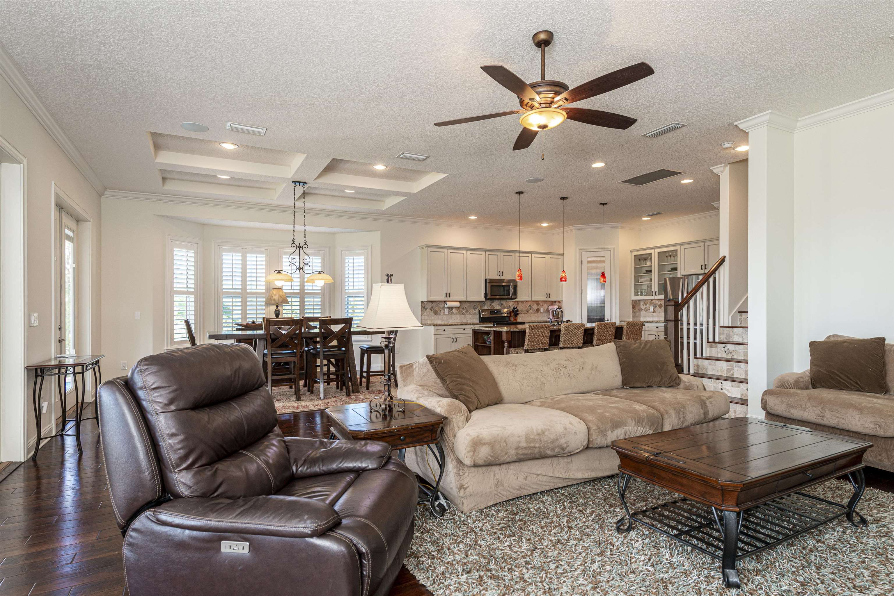 5475 Riverwood Road North St. Augustine, FL 32092 - Photo 3 of 62 Living area with a textured ceiling, stairway, ornamental molding, ceiling fan, and hardwood / wood-style flooring