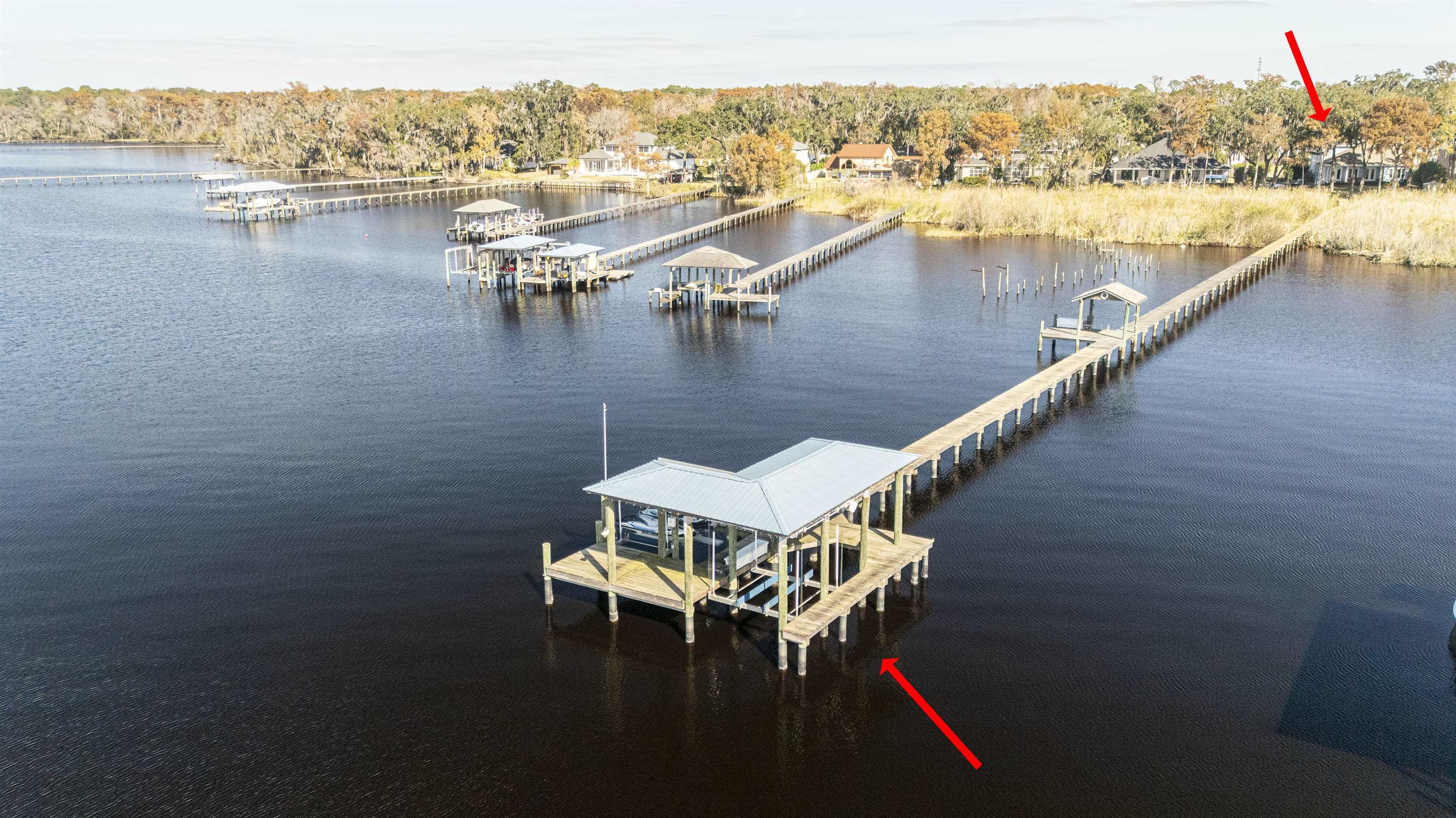 5475 Riverwood Road North St. Augustine, FL 32092 - Photo 36 of 62 Dock area featuring a water view, boat lift, and a forest view