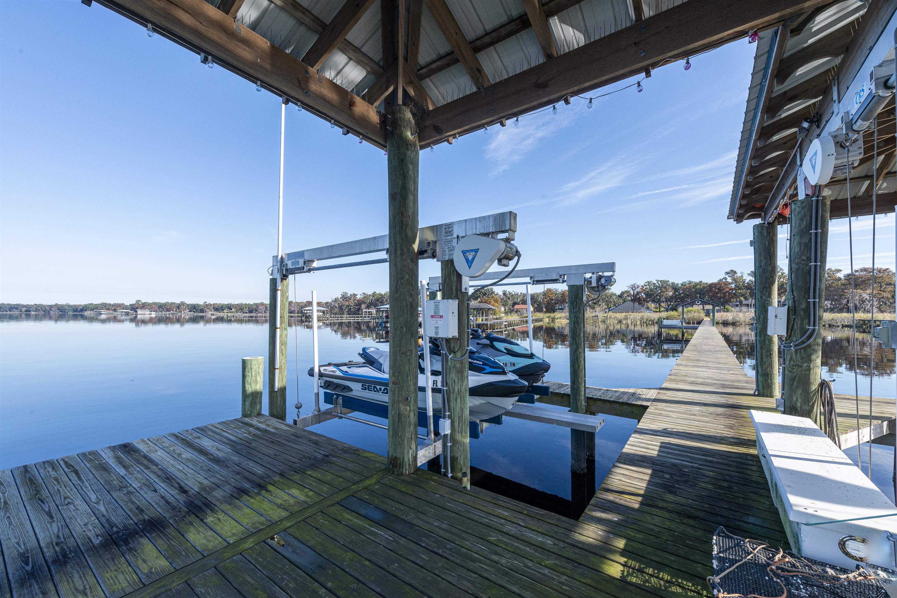 5475 Riverwood Road North St. Augustine, FL 32092 - Photo 40 of 62 Dock with boat lift and a water view
