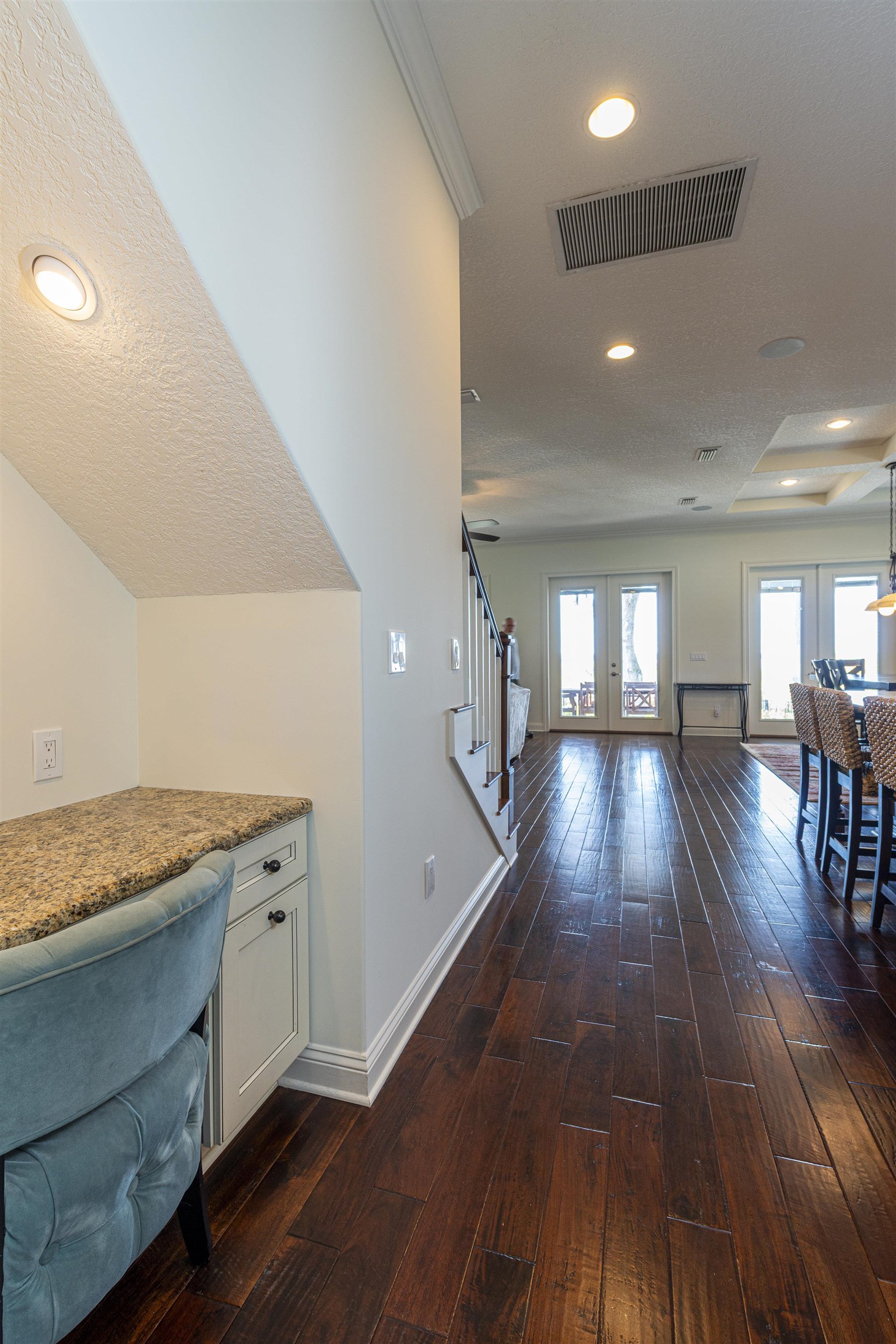 5475 Riverwood Road North St. Augustine, FL 32092 - Photo 45 of 62 Hallway with french doors, stairs, a textured ceiling, recessed lighting, and dark wood-type flooring