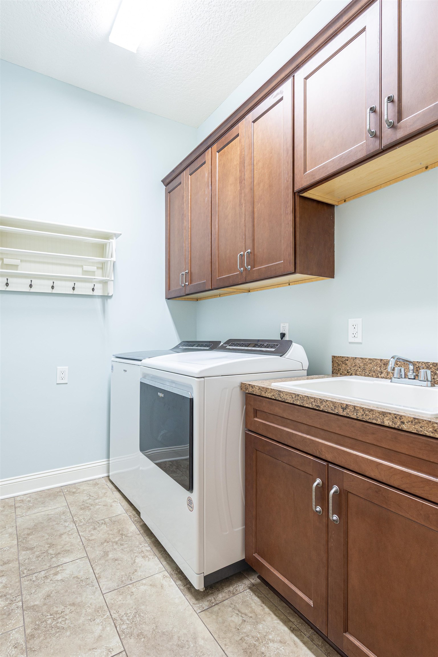 5475 Riverwood Road North St. Augustine, FL 32092 - Photo 46 of 62 Washroom with cabinet space, washing machine and dryer, and a textured ceiling