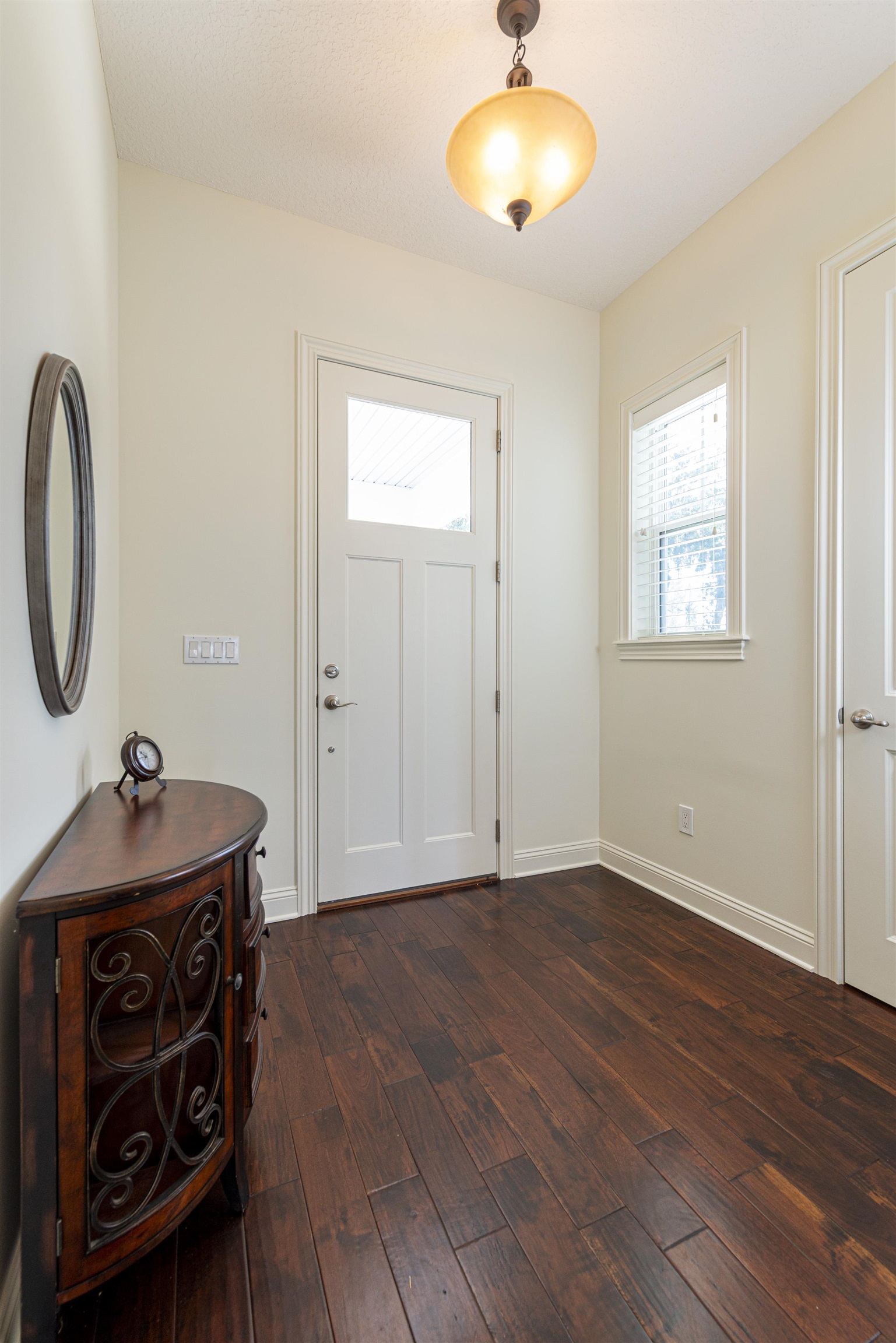 5475 Riverwood Road North St. Augustine, FL 32092 - Photo 47 of 62 Entrance foyer featuring dark wood-style floors and baseboards