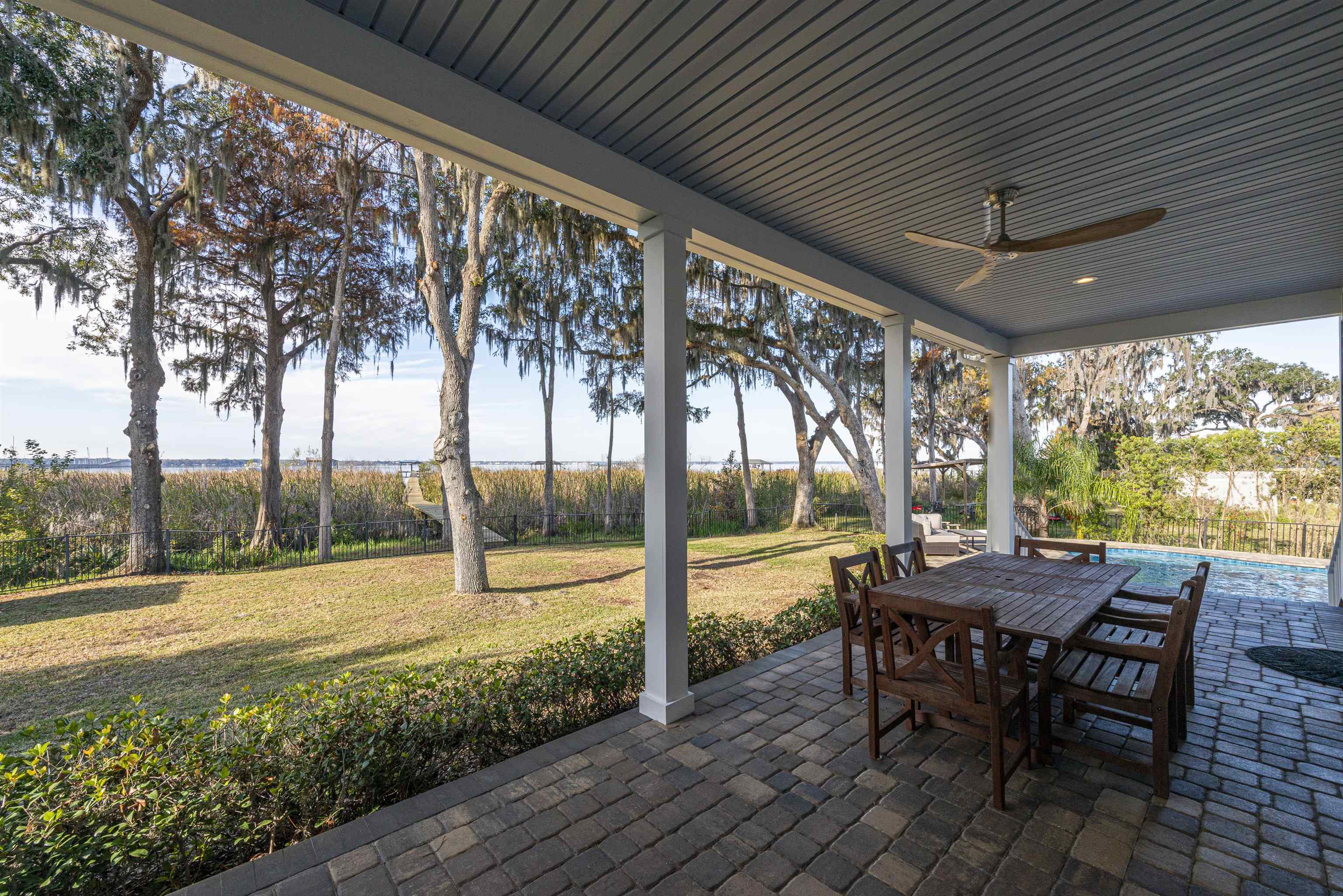 5475 Riverwood Road North St. Augustine, FL 32092 - Photo 54 of 62 View of patio with outdoor dining area and ceiling fan