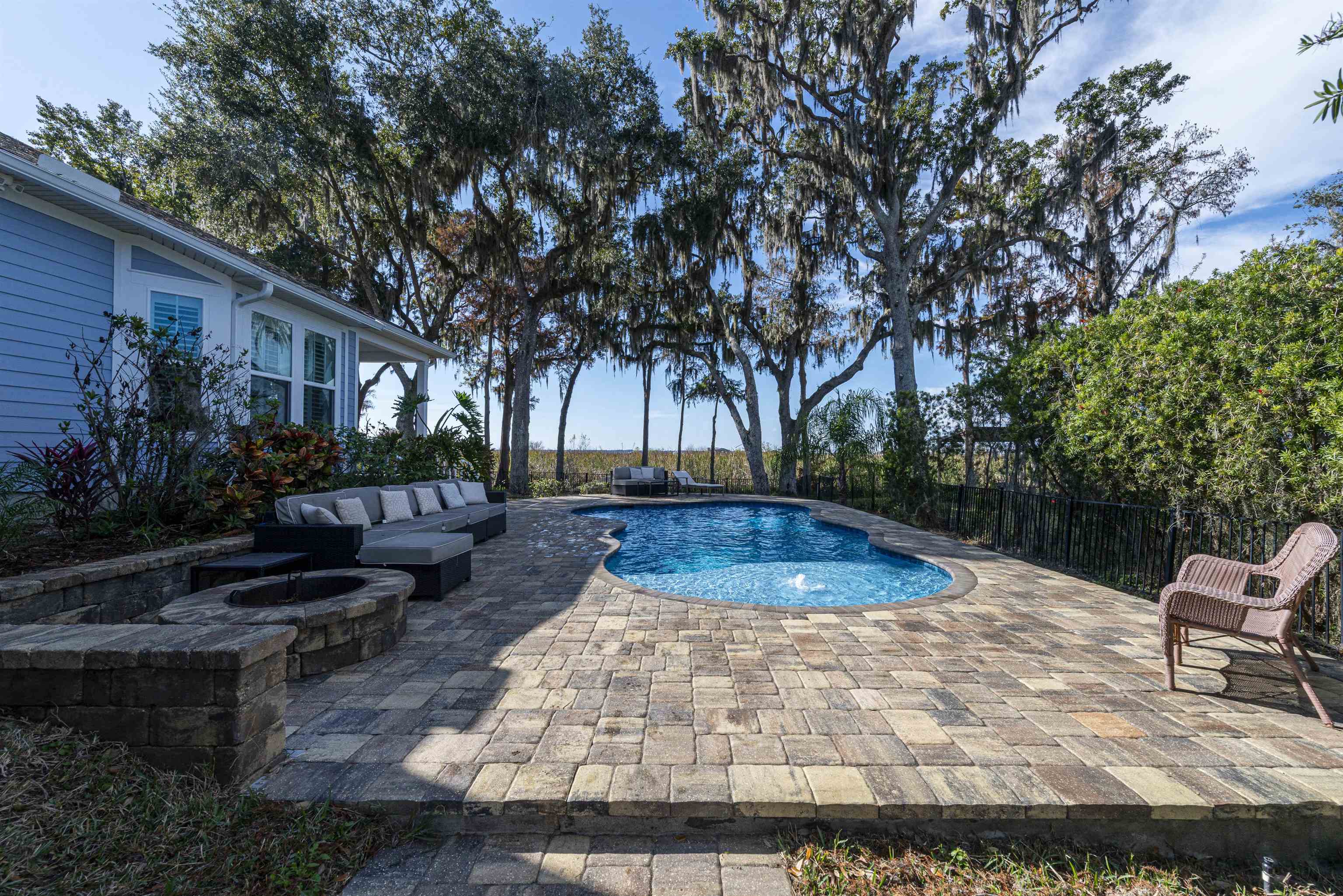 5475 Riverwood Road North St. Augustine, FL 32092 - Photo 55 of 62 View of swimming pool featuring a patio and an outdoor living space with a fire pit