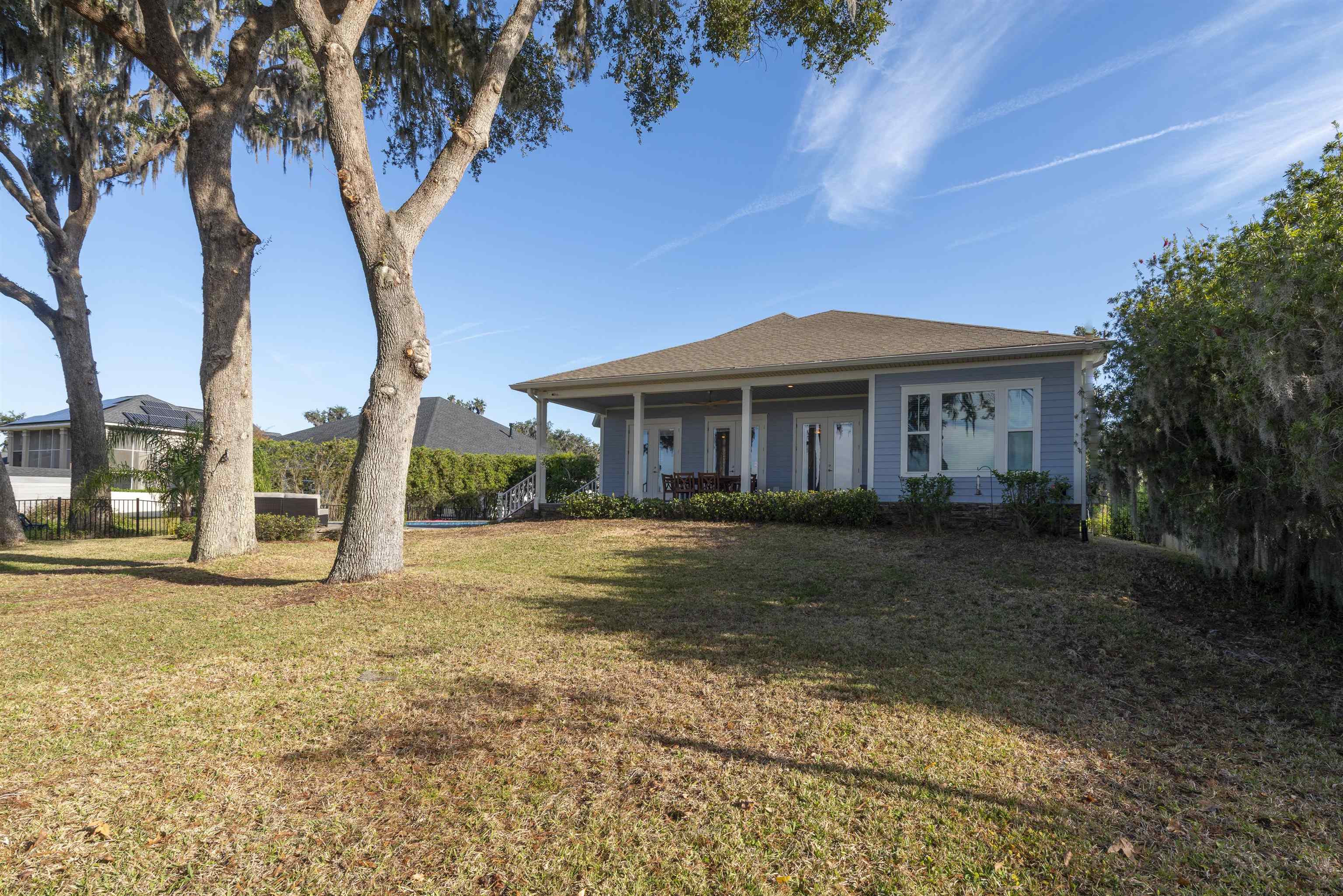 5475 Riverwood Road North St. Augustine, FL 32092 - Photo 55 of 62 Ranch-style house featuring a front yard and a porch