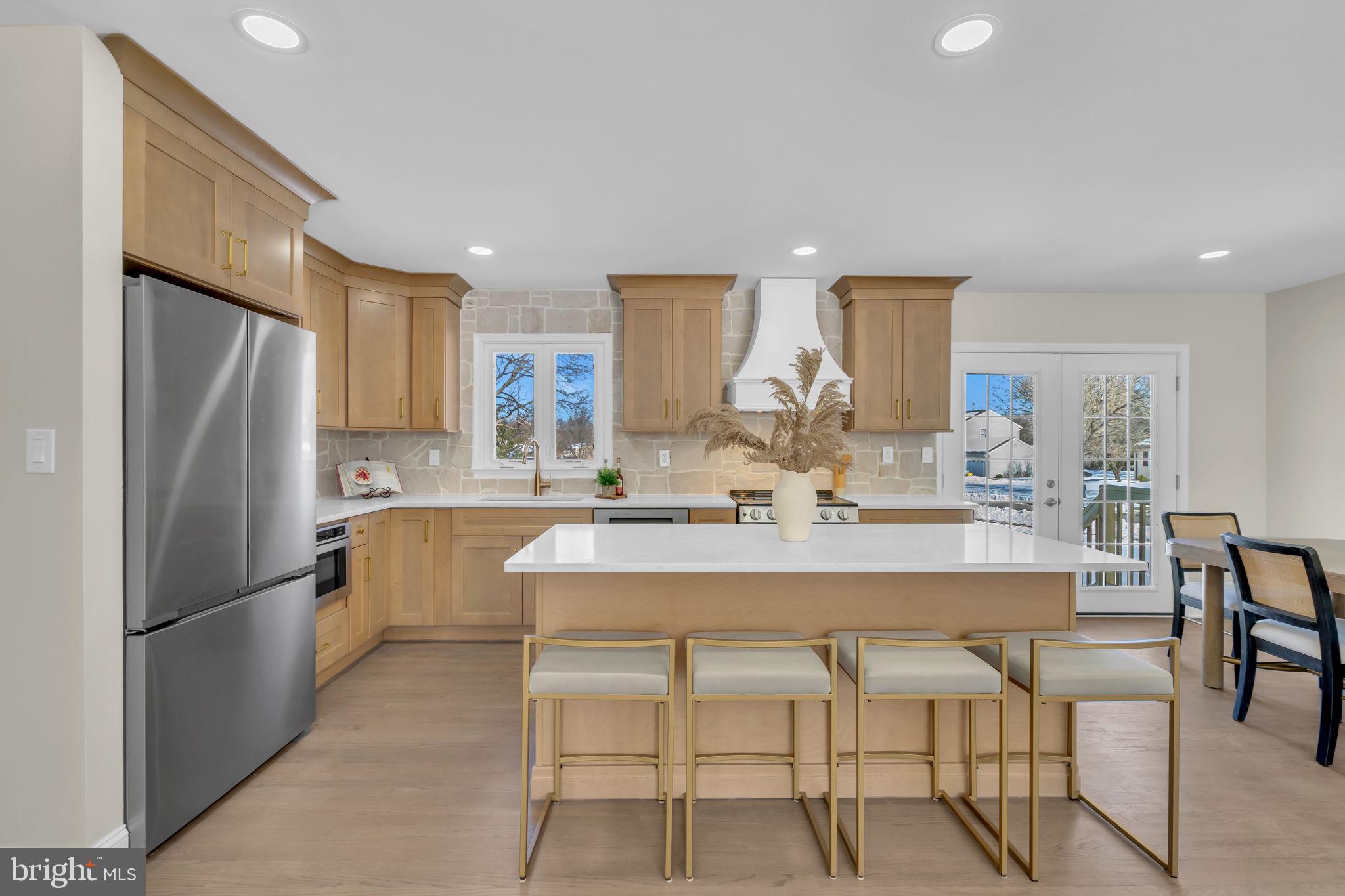 568 Flock Road Trenton, NJ 08690 - Photo 14 of 42 a kitchen with refrigerator a sink and chairs
